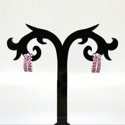 White gold plated silver hoop earrings with natural amethysts in vivid lilac tones; elegant and timeless gemstone design.