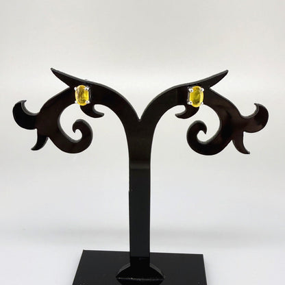 Natural yellow sapphire stud earrings in white gold plated sterling silver with butterfly backs.