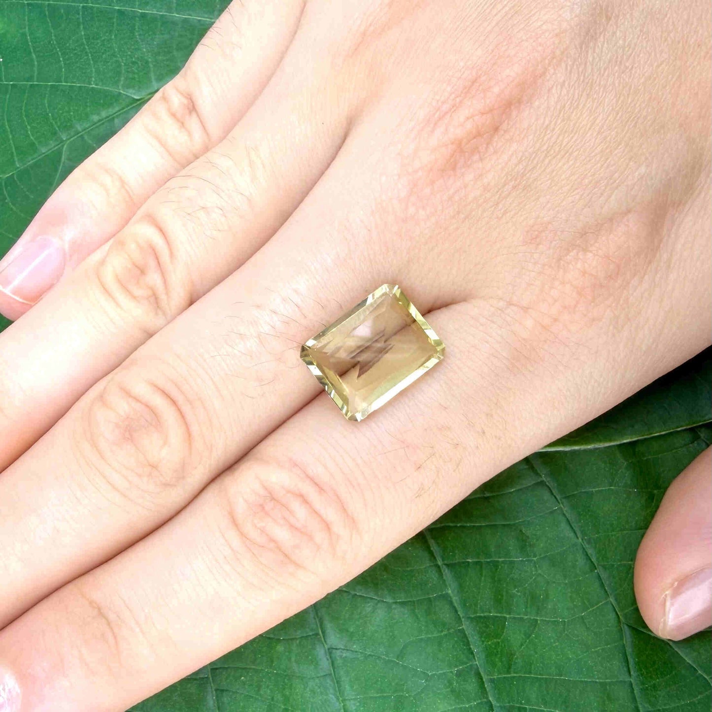 5.6 ct natural lemon quartz, faceted with bright yellow color.