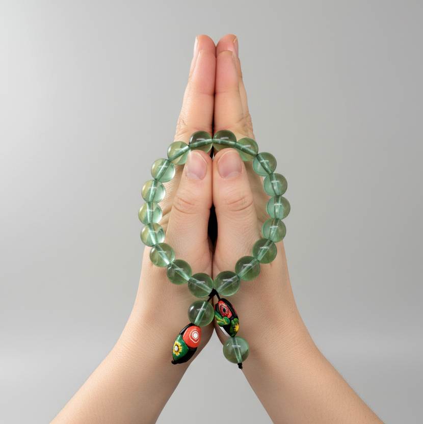 Green quartz mala bracelet made from natural green quartz beads, symbolizing balance, renewal, and emotional harmony.