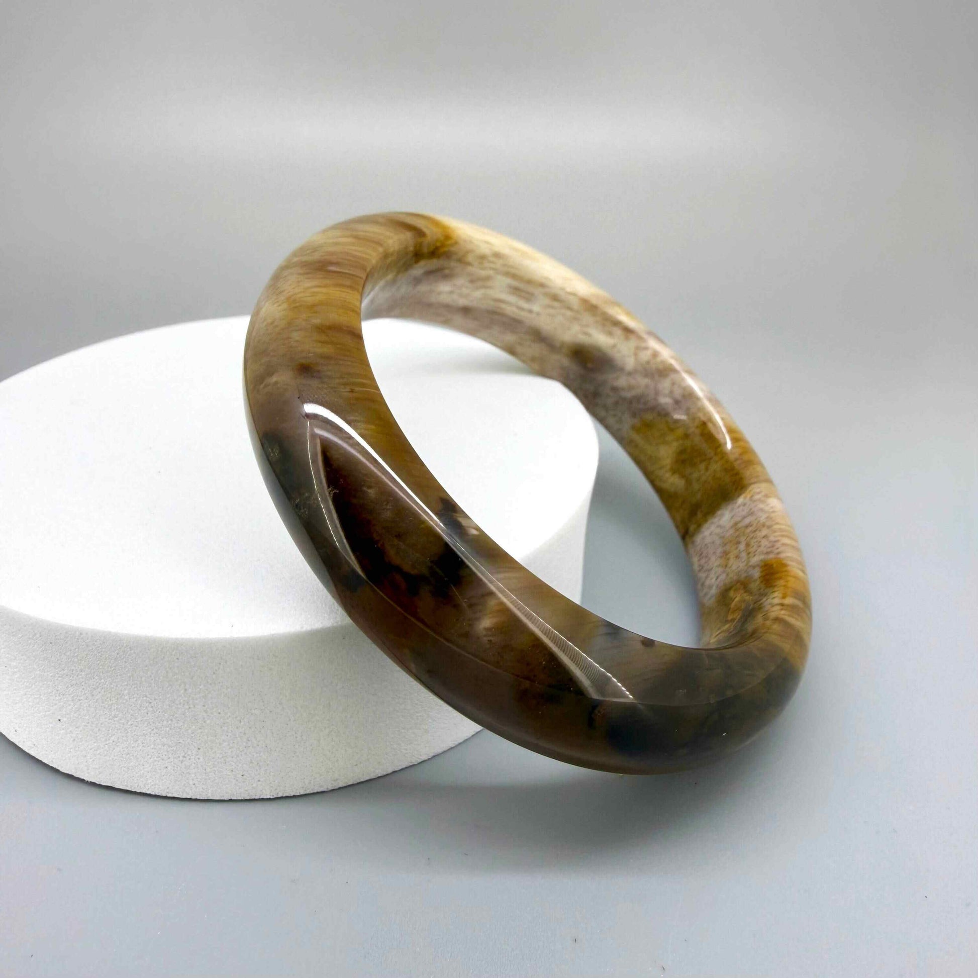 Natural jade bangle bracelet in beige and brown tones, smooth polished finish, 18 cm inner circumference