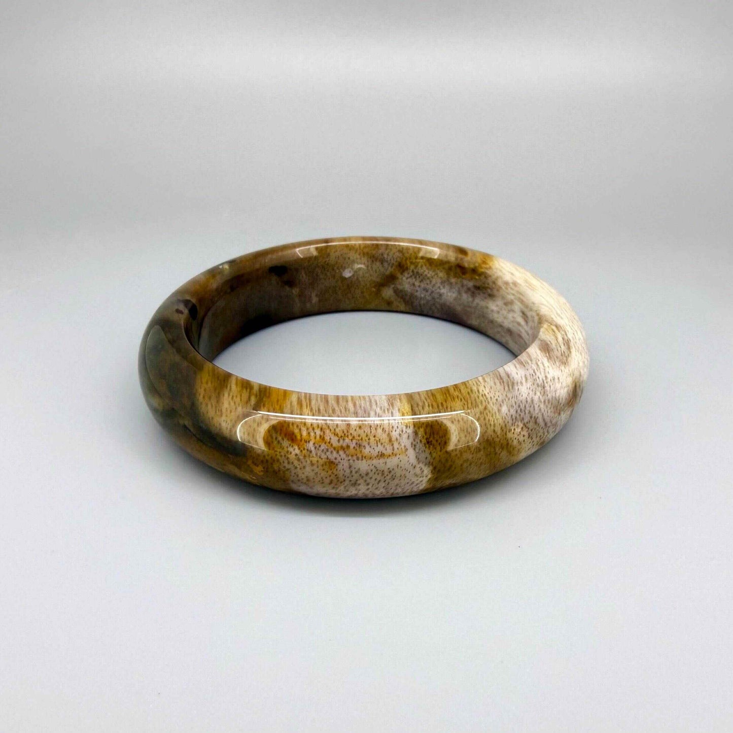 Natural jade bangle bracelet in beige and brown tones, smooth polished finish, 18 cm inner circumference