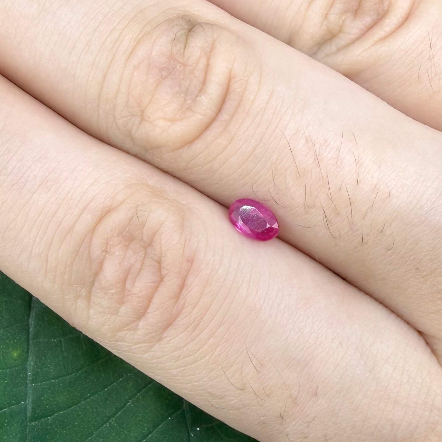 0.32 ct natural pink-red Songea ruby, oval cut.