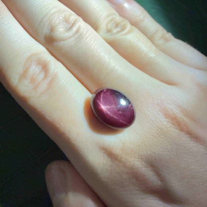15.5 ct natural Bordeaux-Red Star Ruby cabochon from Mozambique with soft star effect and polished dome.