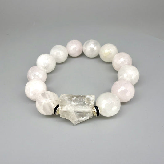 Rose quartz beaded bracelet, 18cm, light pink gemstone beads with larger clear accent stone on elastic stretch band.