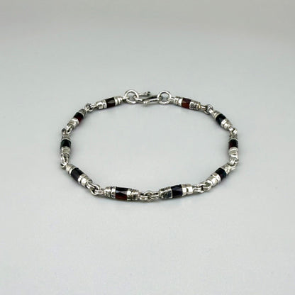 Garnet Pyrope bracelet styled on wrist with natural lighting, showcasing deep red hues