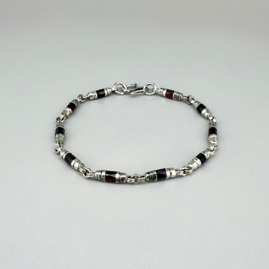 Garnet Pyrope bracelet styled on wrist with natural lighting, showcasing deep red hues