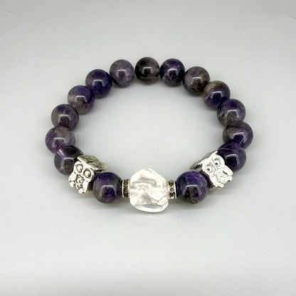 Amethyst beaded bracelet, 18cm, violet gemstone beads with large clear white focal stone and two owl accents on elastic stretch band.