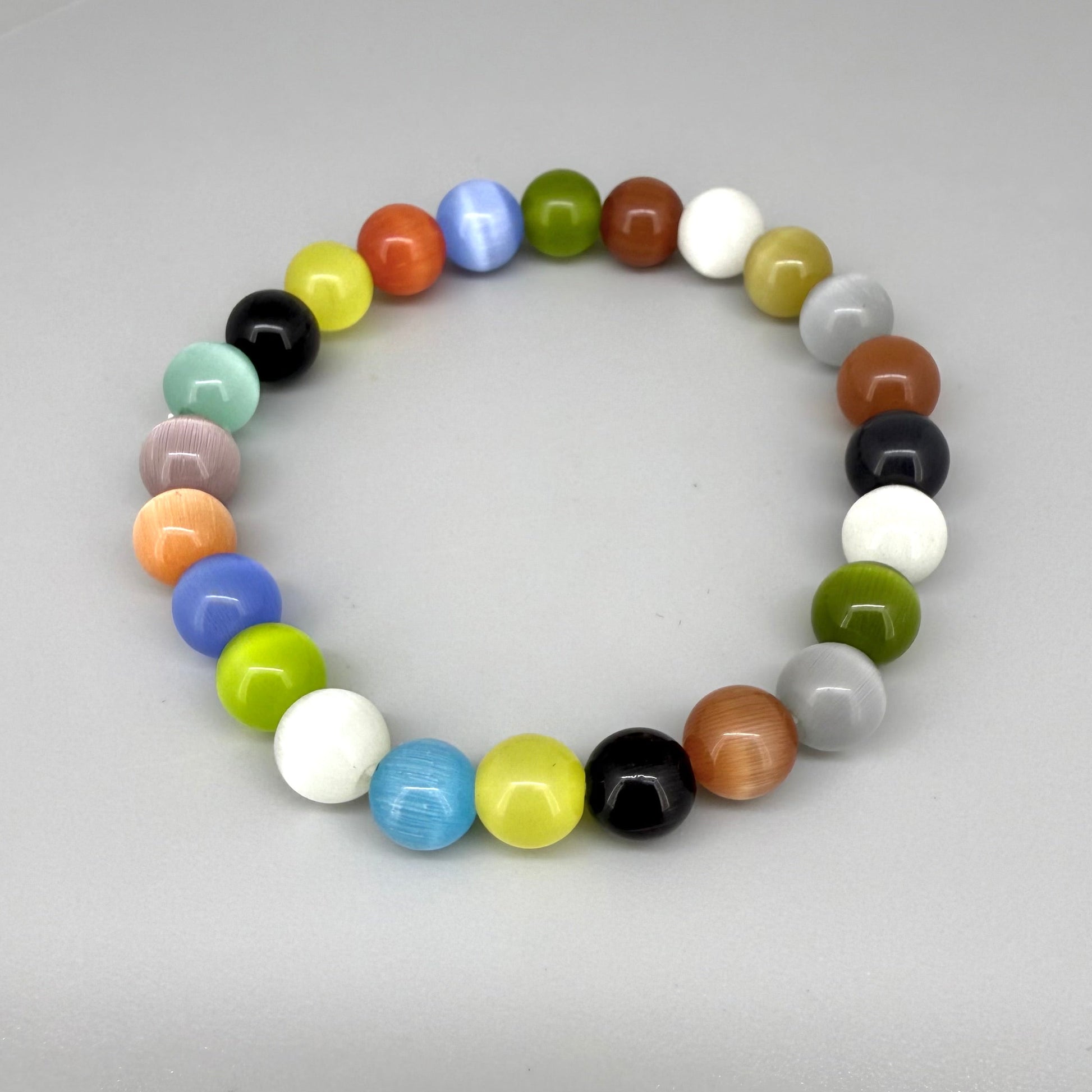 Multicolor cat’s eye beaded bracelet, 17cm, bright shimmering gemstone beads on elastic stretch band.
