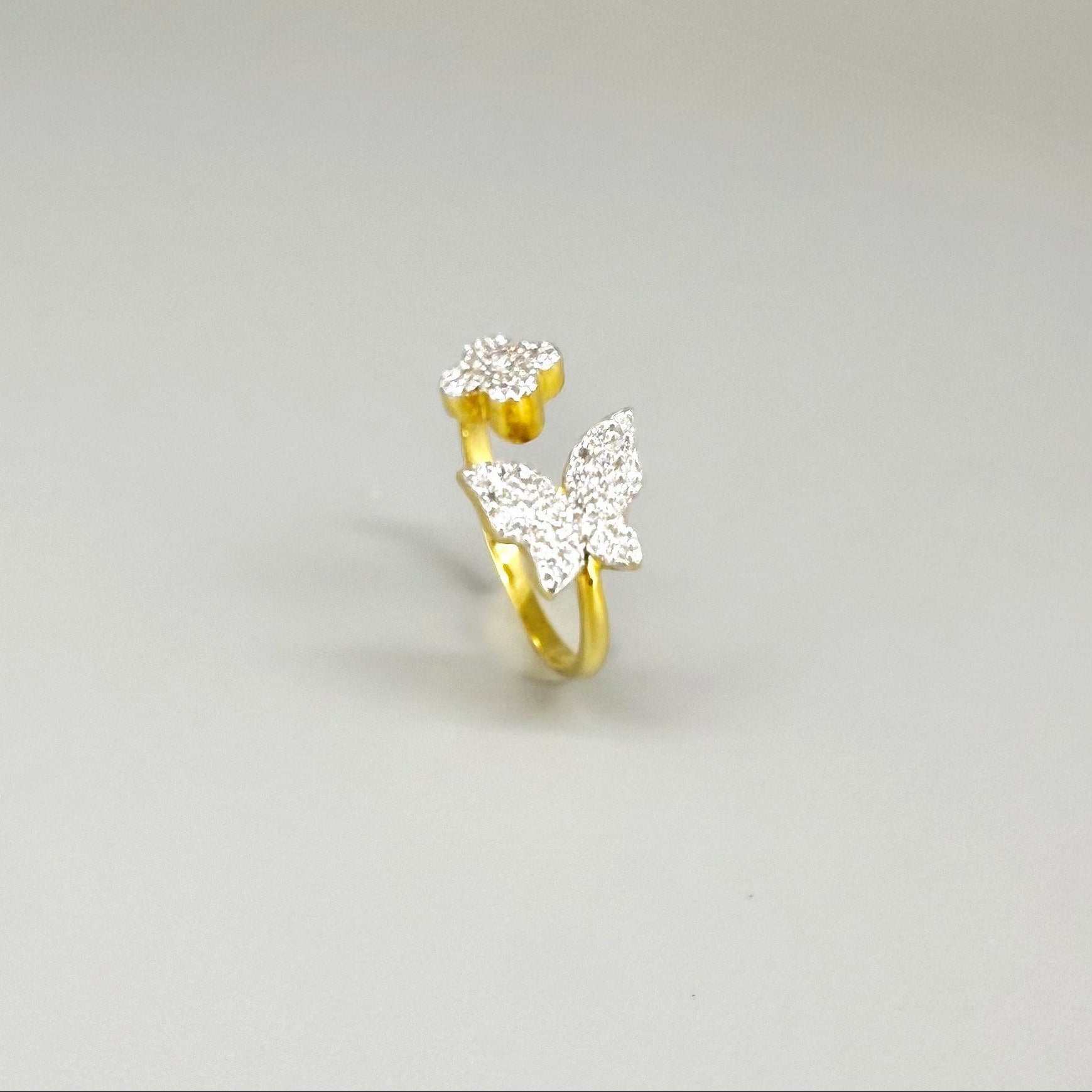 23k gold butterfly and flower ring with 47 cubic zirconia in open design, size 57.