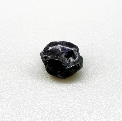 Untreated sky to royal blue sapphire rough, natural uncut corundum photographed on neutral background.