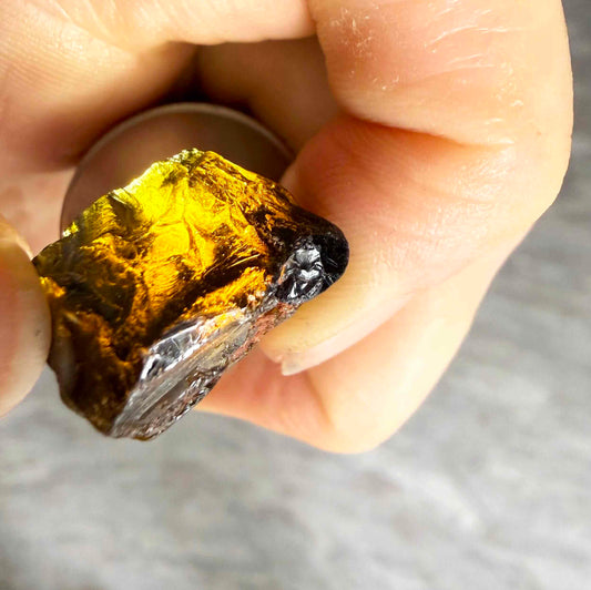 Untreated yellow sapphire rough with rich golden coloration, natural uncut corundum stone.