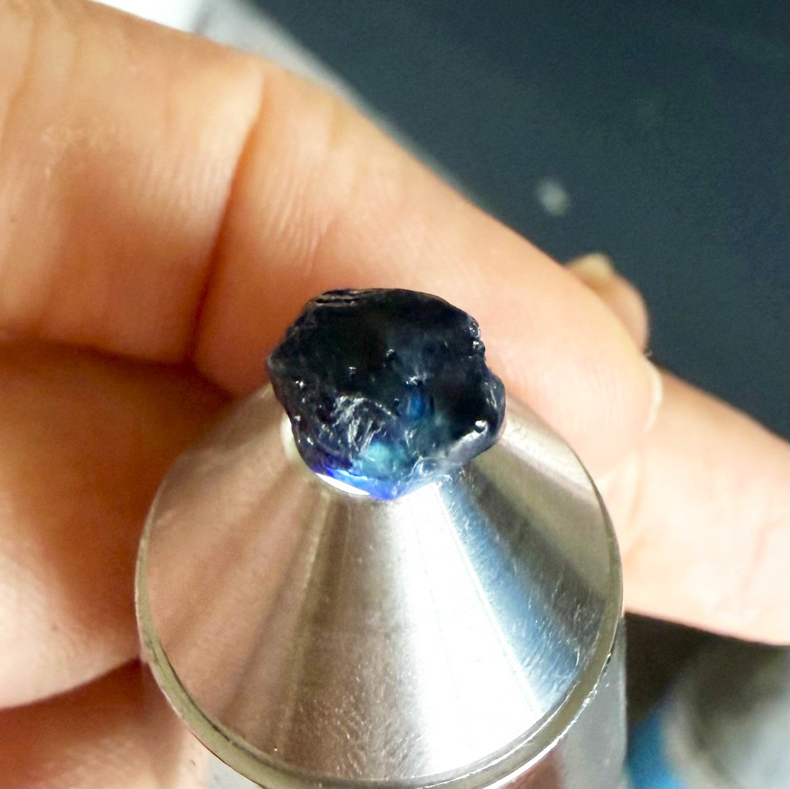Untreated sky to royal blue sapphire rough, natural uncut corundum photographed on neutral background.