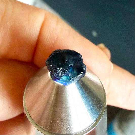 Untreated sky to royal blue sapphire rough, natural uncut corundum photographed on neutral background.