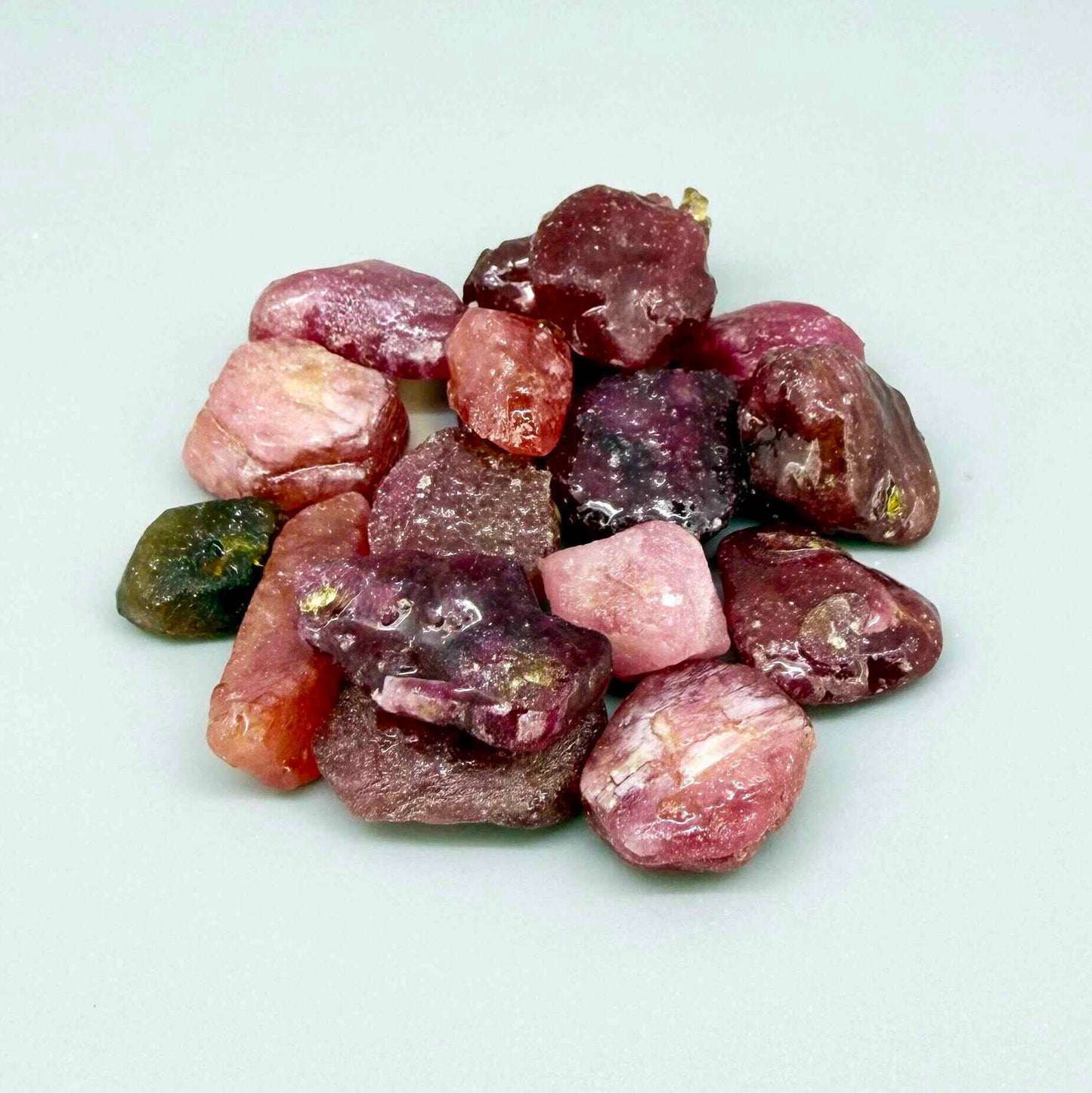 Ruby rough (Corundum) in vibrant red hues, treated and lightly oiled, small curated lot.