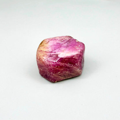 Natural Ruby rough (Corundum) in pink-lilac tones, treated gemstone specimen.