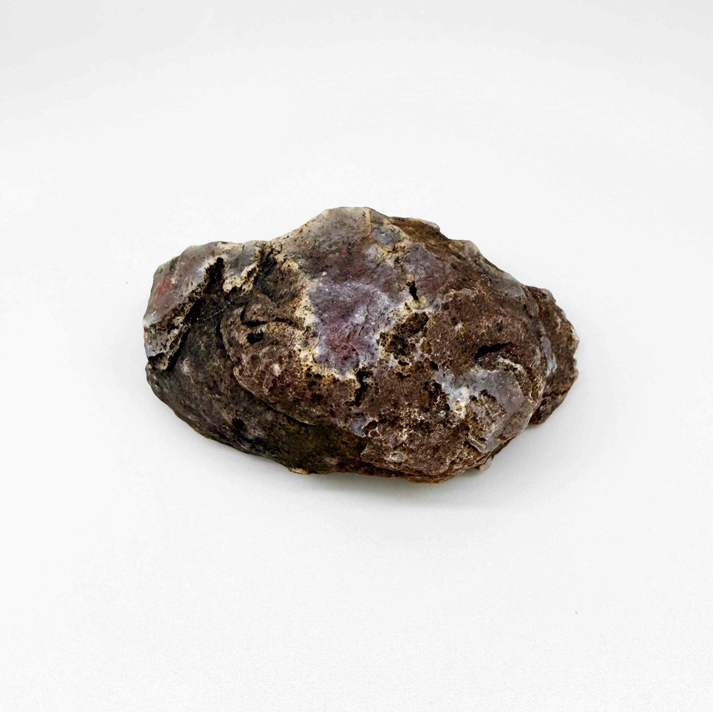 Chalcedony agate rough stone with bright orange-red carnelian core and white outer banding.