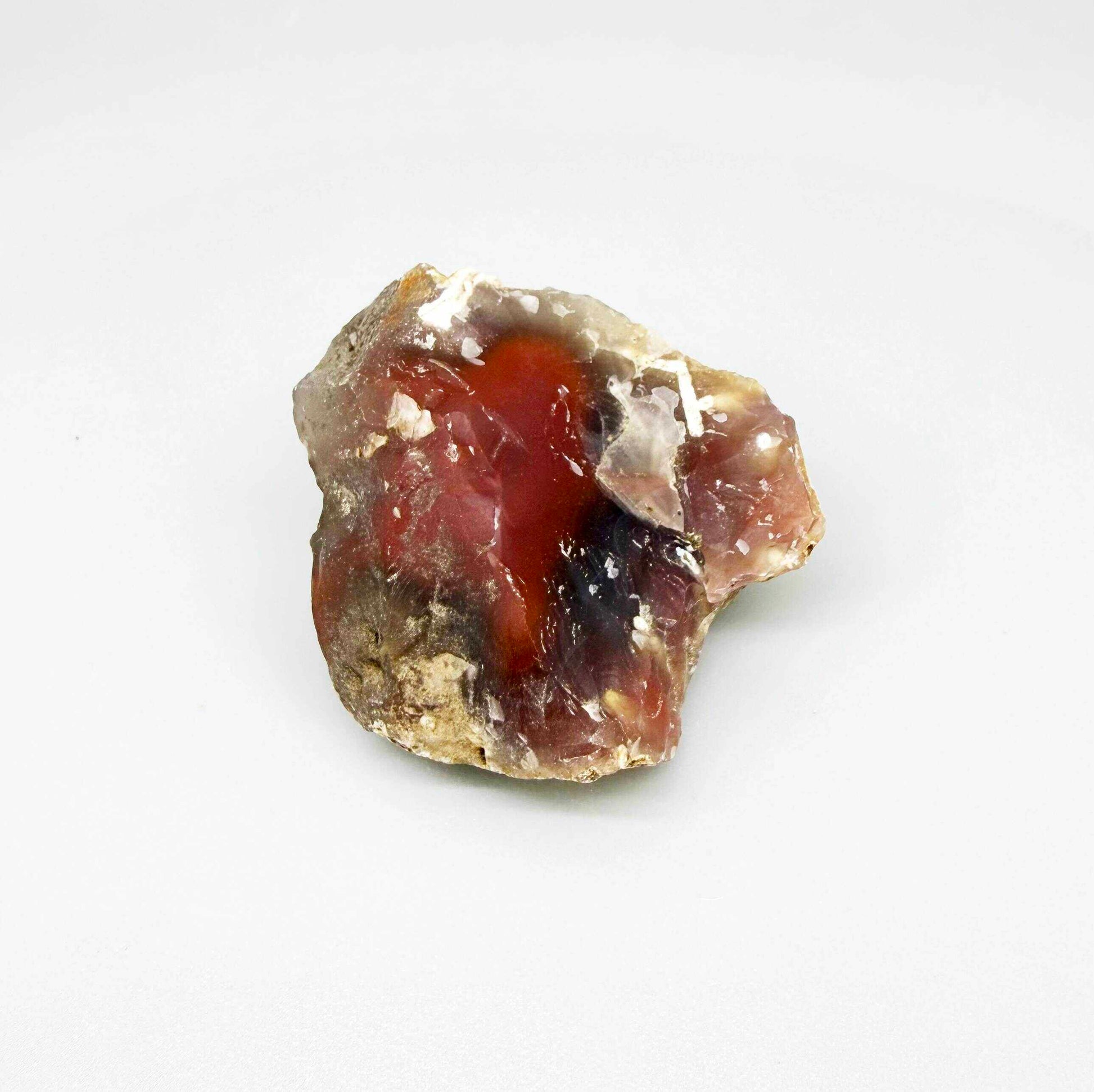 Chalcedony rough stone with orange-red carnelian core and darker translucent zones, natural quartz specimen.