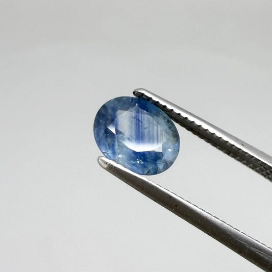 Round light medium blue sapphire from Sri Lanka with natural color zoning and lively brilliance.