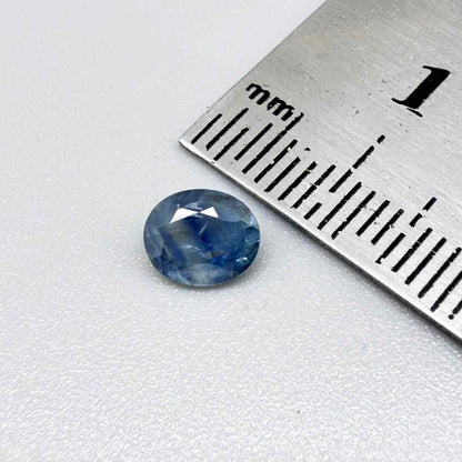 Round light medium blue sapphire from Sri Lanka with natural color zoning and lively brilliance.