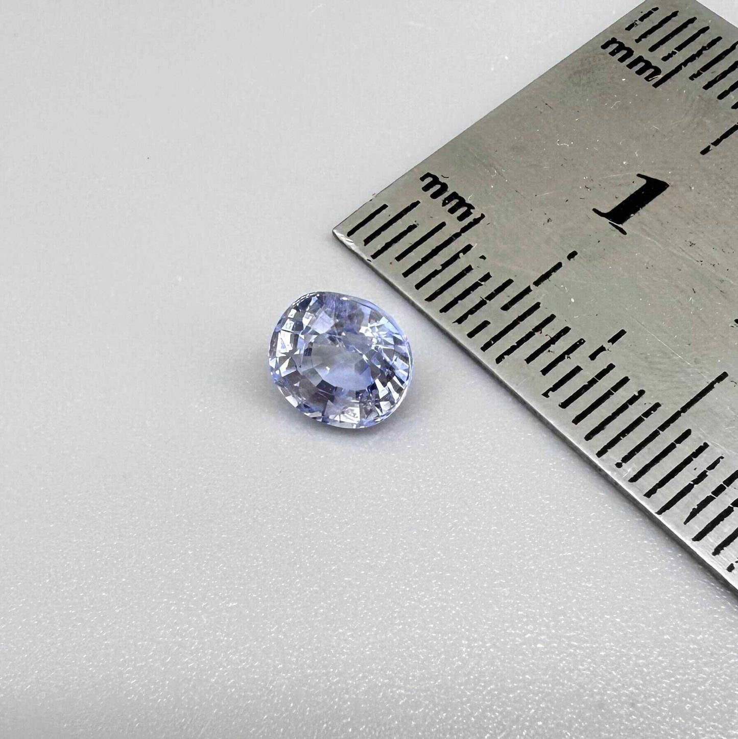 Light cornflower blue sapphire from Sri Lanka in oval cut with bright brilliance and natural transparent crystal structure.