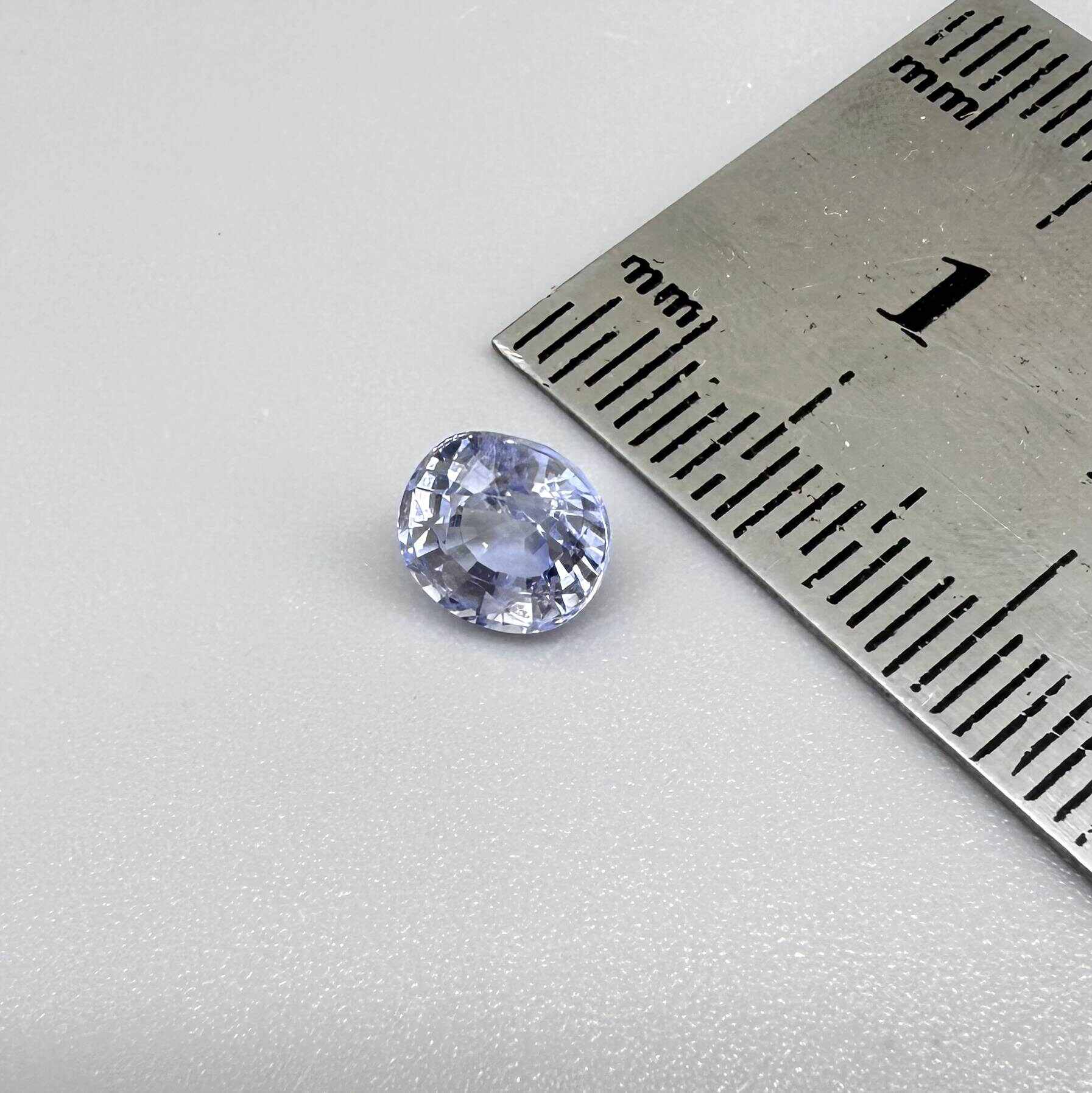 Light cornflower blue sapphire from Sri Lanka in oval cut with bright brilliance and natural transparent crystal structure.