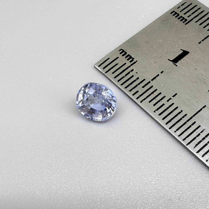 Light cornflower blue sapphire from Sri Lanka in oval cut with bright brilliance and natural transparent crystal structure.