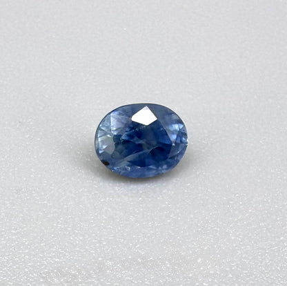 Soft medium blue sapphire in oval cut with natural silky texture and gentle blue color tone.