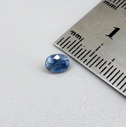 Soft medium blue sapphire in oval cut with natural silky texture and gentle blue color tone.