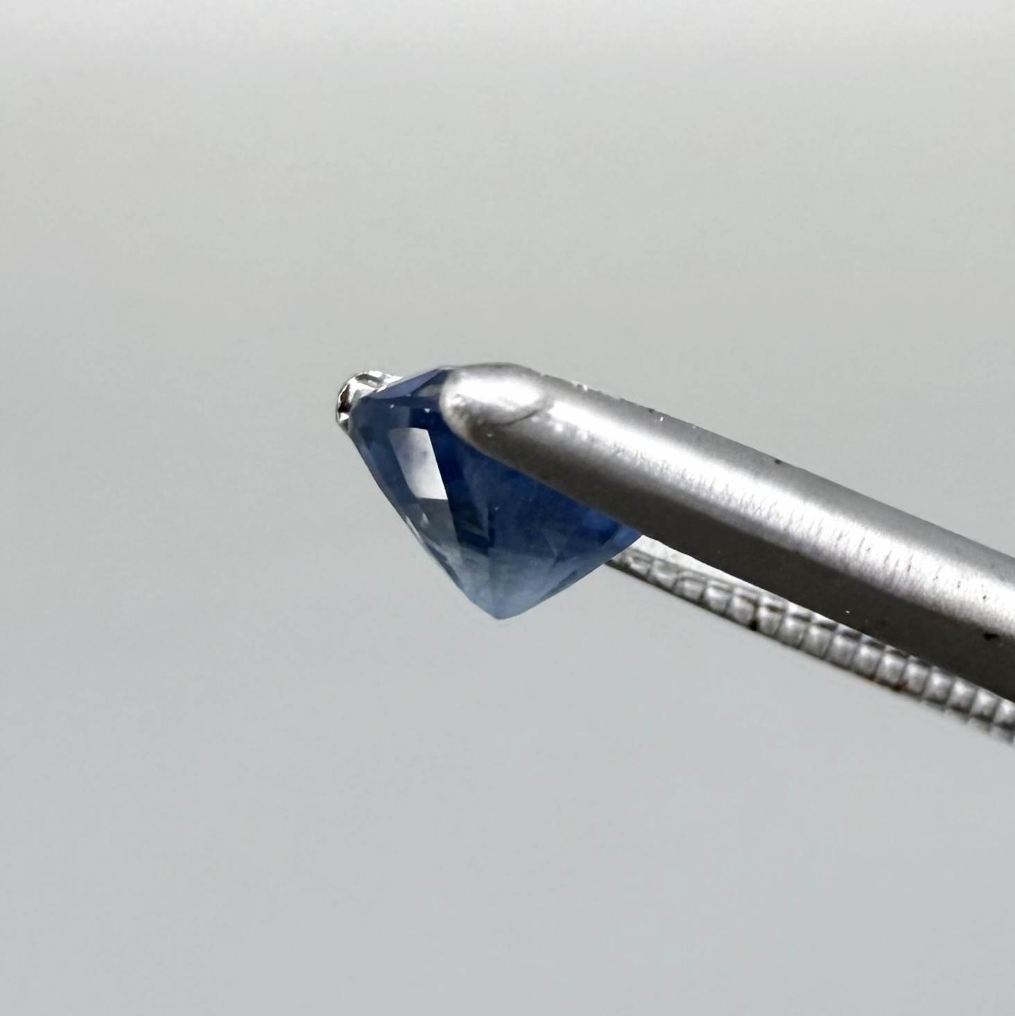 Soft medium blue sapphire in oval cut with natural silky texture and gentle blue color tone.