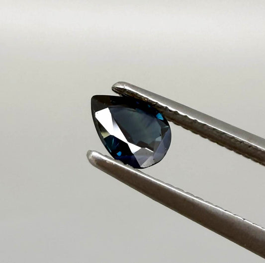 Dark slate blue sapphire from Bangkaja, Thailand in pear cut with deep inky blue tone and natural brilliance.