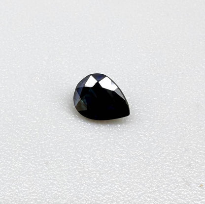 Dark slate blue sapphire from Bangkaja, Thailand in pear cut with deep inky blue tone and natural brilliance.
