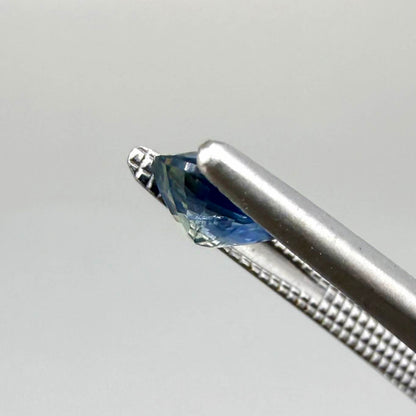 Oval cut light medium blue sapphire from Bangkaja, Thailand with natural color zoning and faceted brilliance.