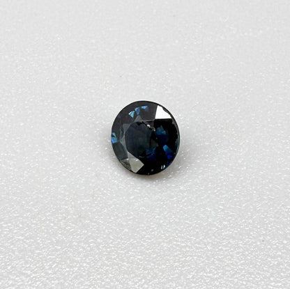 Round-cut vivid deep blue sapphire from Bangkaja, Thailand, natural faceted gemstone.