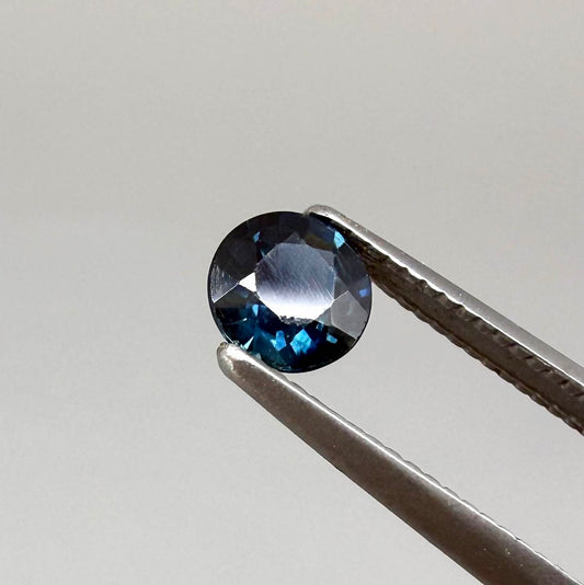 Round-cut vivid deep blue sapphire from Bangkaja, Thailand, natural faceted gemstone.