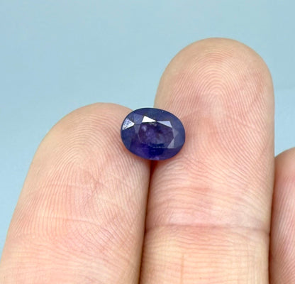 Oval-cut rich purple sapphire from Thailand, natural faceted gemstone suitable for fine jewelry.