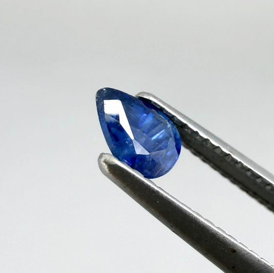 Pear-cut royal blue sapphire from Bangkaja, Thailand, natural faceted gemstone with deep blue color.