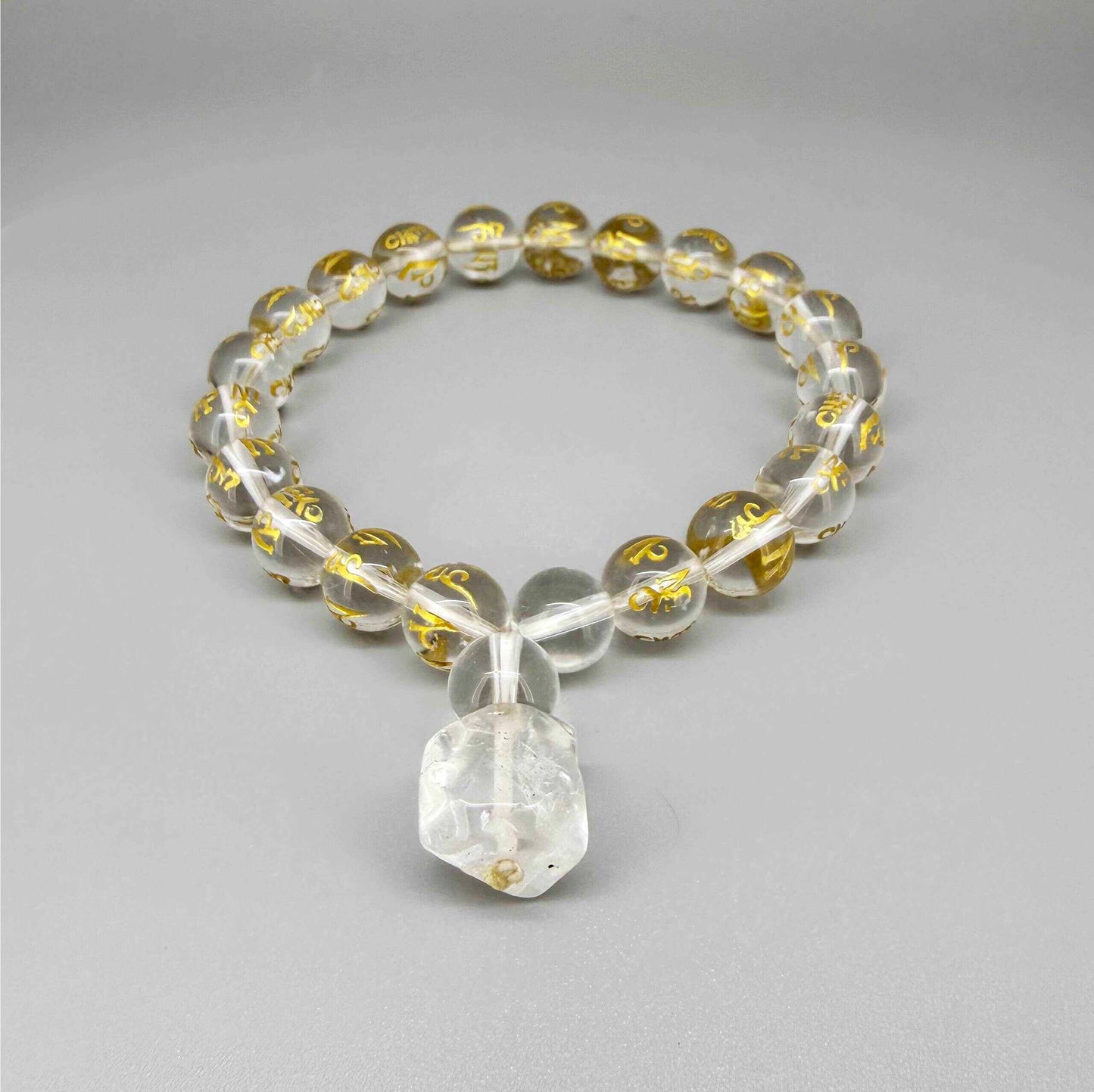 Clear quartz mala bracelet with 21 engraved beads and Om Mani Padme Hum mantra. A meaningful piece for clarity, intention and inner peace.
