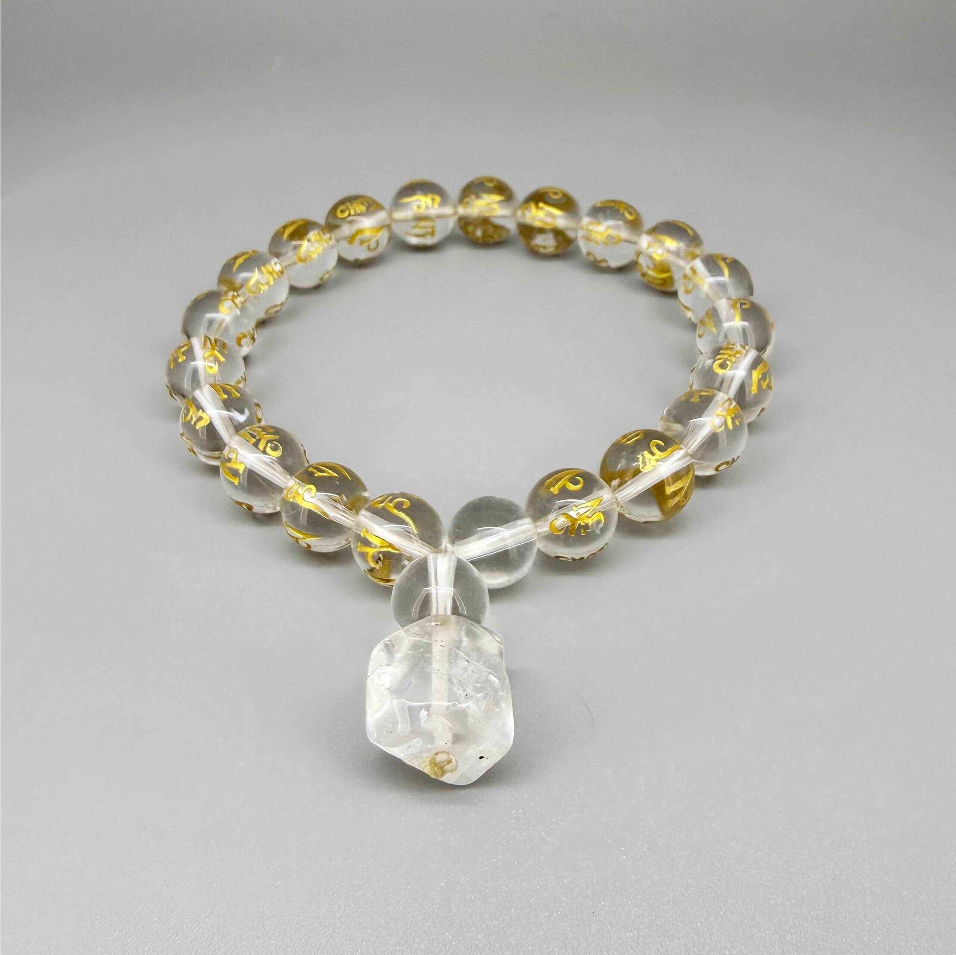 Clear quartz mala bracelet with 21 engraved beads and Om Mani Padme Hum mantra. A meaningful piece for clarity, intention and inner peace.