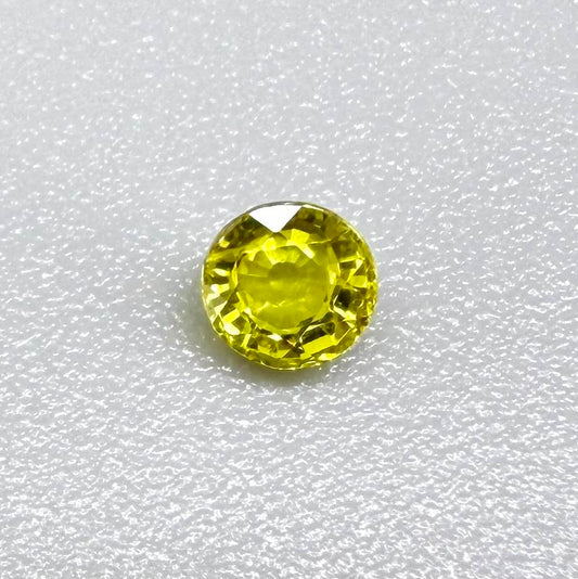 Round lemon yellow sapphire from Bangkaja, Thailand with bright vivid color and excellent brilliance.