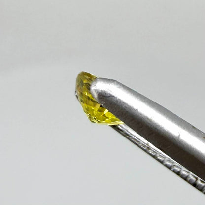 Round lemon yellow sapphire from Bangkaja, Thailand with vivid bright color and clean, lively brilliance.