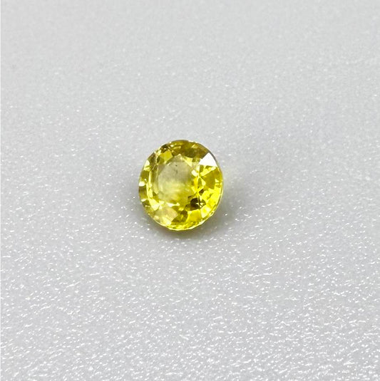 Round lemon yellow sapphire from Bangkaja, Thailand with vivid bright color and clean, lively brilliance.