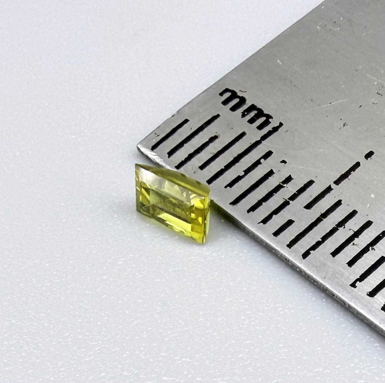 Baguette lemon yellow sapphire from Bangkaja, Thailand with bright vivid color and sharp faceting.