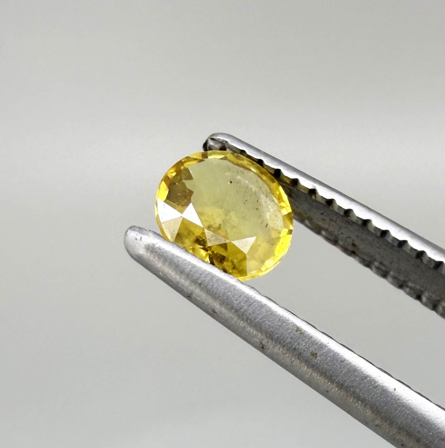 Round golden yellow sapphire from Bangkaja, Thailand with bright natural color and lively brilliance.