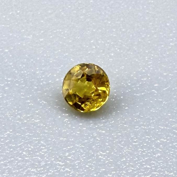 Round rich golden yellow sapphire from Bangkaja, Thailand with warm tone and strong natural brilliance.