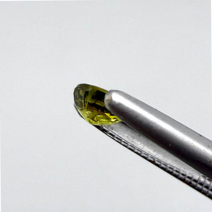 Round pale lemon yellow sapphire from Bangkaja, Thailand with soft luminous color and natural brilliance.