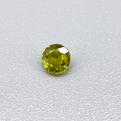 Round pale lemon yellow sapphire from Bangkaja, Thailand with soft luminous color and natural brilliance.