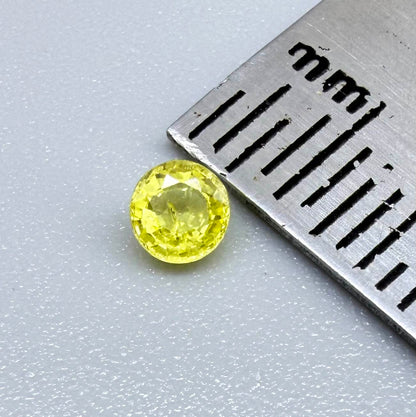 Round light lemon yellow sapphire from Bangkaja, Thailand with delicate bright color and clean natural brilliance.