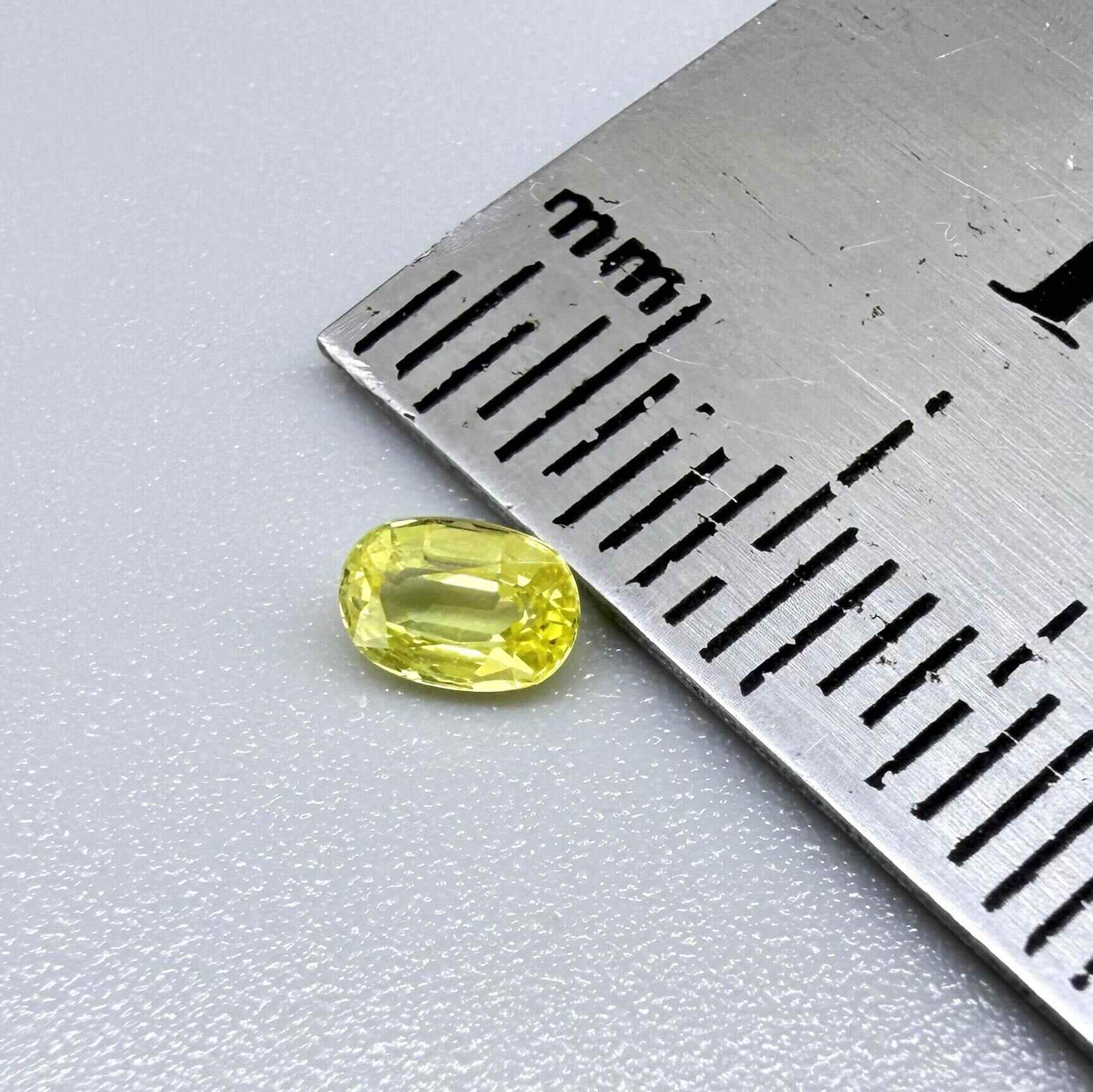 Oval light lemon yellow sapphire from Bangkaja, Thailand with fresh bright color and natural brilliance.