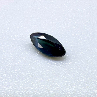 Marquise dark teal blue sapphire from Bangkaja, Thailand with deep blue-green tone and natural color zoning.